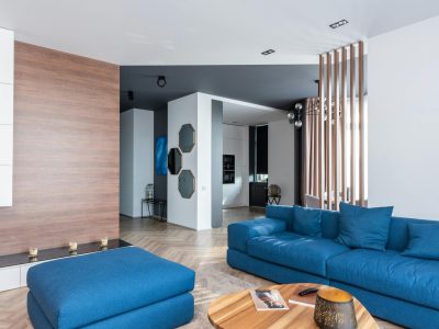 Minimalist bedroom with warm lighting and compact storage with Yellow Wall Decor.